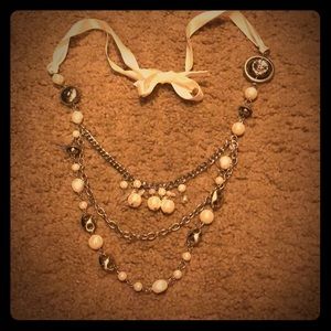 Ribbon tied pearl and silver costume necklace